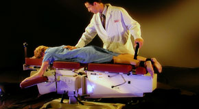 This is a picture of Cox Technic chiropratic spinal manipulation as performed at Paulette Hugulet, DC, LLC.