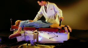 This is a picture of Cox Technic chiropratic spinal manipulation as performed at Dr. Paulette Hugulet, DC, LLC.